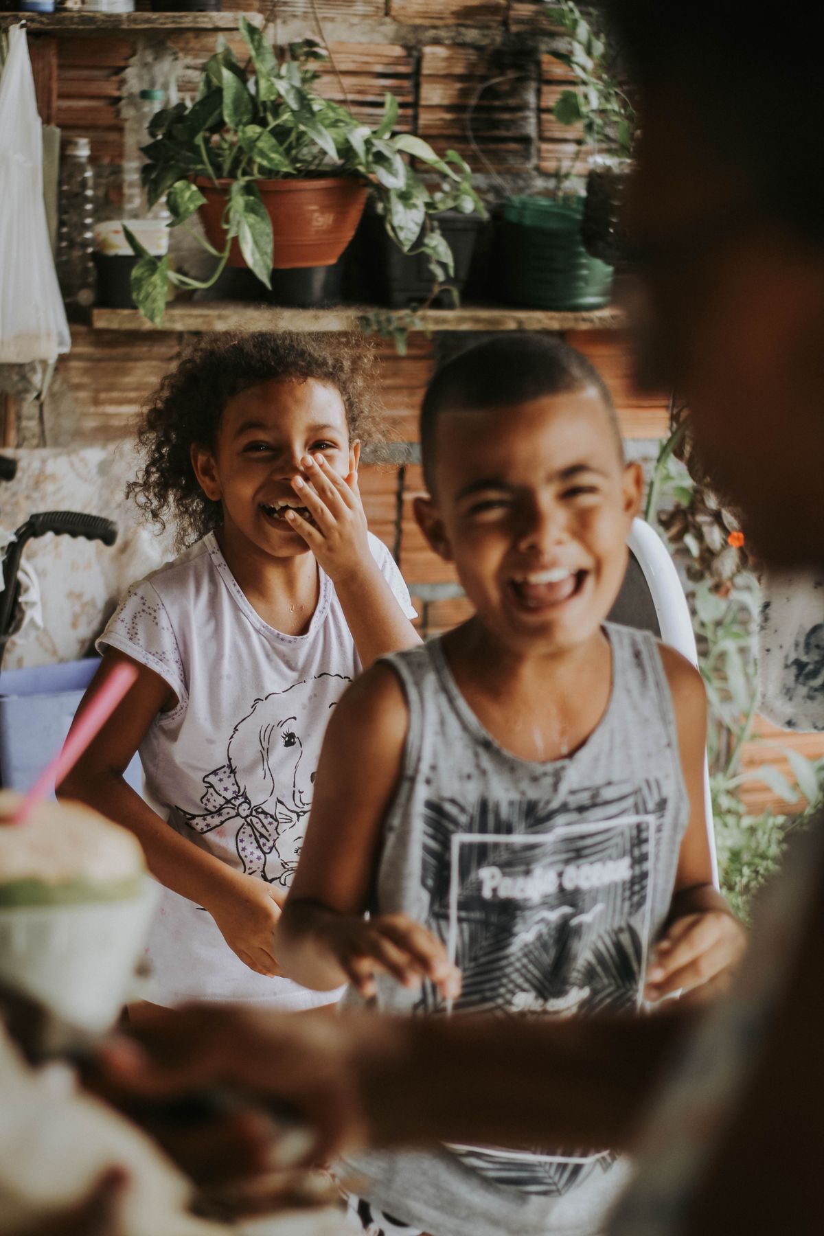Siblings laughing together during a family moment