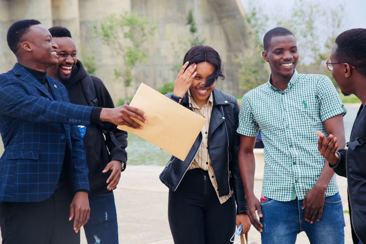 A happy group of friends laughing together outdoors